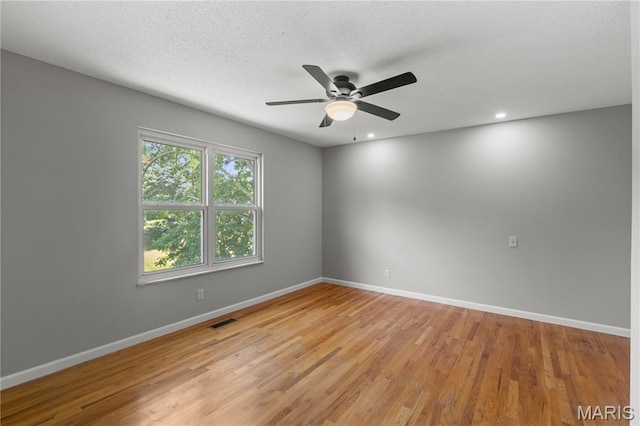 502 Lalor Dr, Manchester, MO 63011 - spare room featuring a ceiling fan, light wood-style flooring, recessed lighting, and a textured ceiling