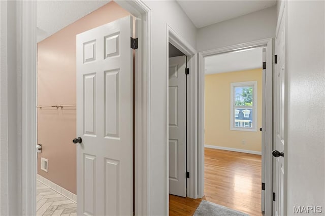 502 Lalor Dr, Manchester, MO 63011 - hall with baseboards and light wood finished floors