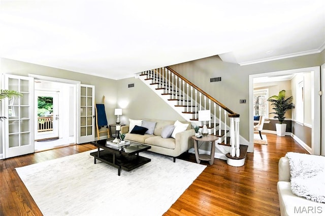 8049 Gannon Ave, Saint Louis, MO 63130 - living room with stairway, wood finished floors, and ornamental molding