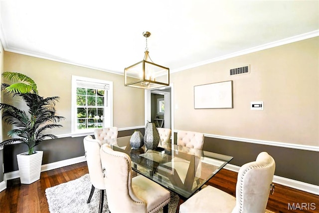 8049 Gannon Ave, Saint Louis, MO 63130 - dining space with a chandelier, wood finished floors, and crown molding