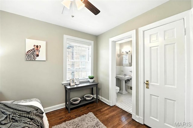 8049 Gannon Ave, Saint Louis, MO 63130 - bedroom with dark wood-style floors, ensuite bathroom, and ceiling fan