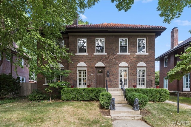 316 Melville Ave, University City, MO 63130 - view of front facade with a tiled roof and brick siding