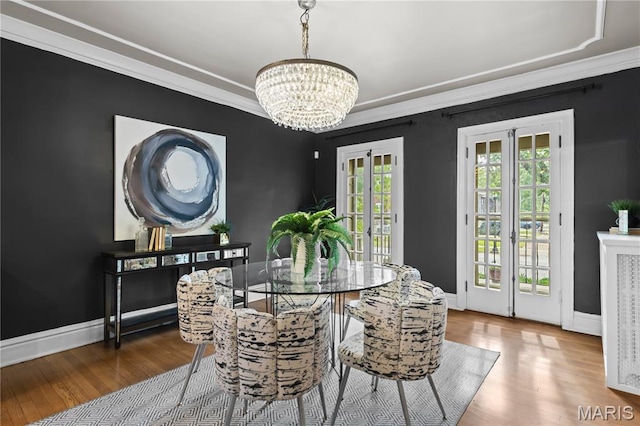 316 Melville Ave, University City, MO 63130 - dining room with a chandelier, wood finished floors, crown molding, and french doors