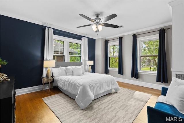 316 Melville Ave, University City, MO 63130 - bedroom with ornamental molding, wood finished floors, and a ceiling fan