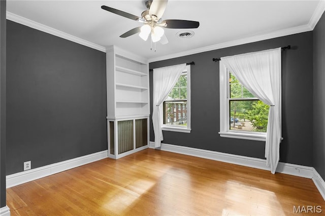 316 Melville Ave, University City, MO 63130 - unfurnished room with wood finished floors, ceiling fan, ornamental molding, and built in shelves
