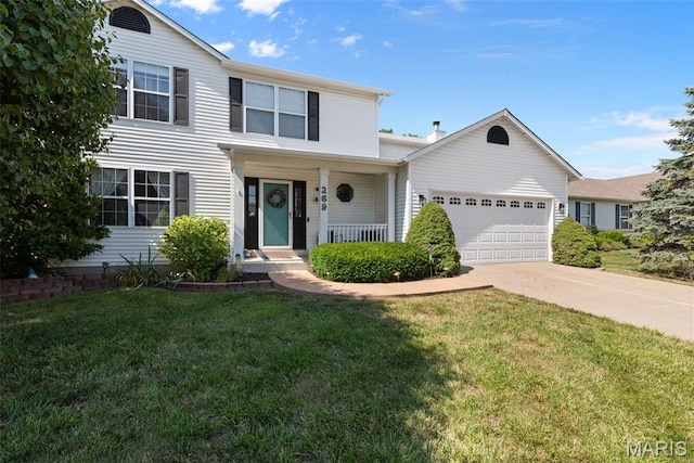 269 Sassafras Parc Dr, Ofallon, MO 63368 - traditional home featuring a garage, concrete driveway, a front lawn, and covered porch