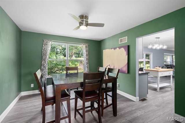 269 Sassafras Parc Dr, Ofallon, MO 63368 - dining area with wood finished floors, plenty of natural light, and a ceiling fan