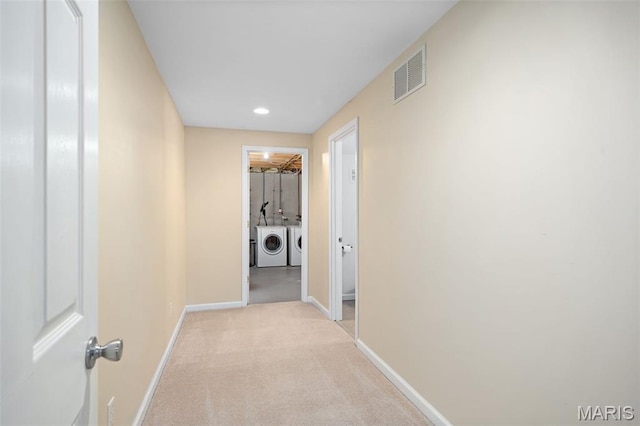 269 Sassafras Parc Dr, Ofallon, MO 63368 - corridor featuring washing machine and dryer, light carpet, and recessed lighting