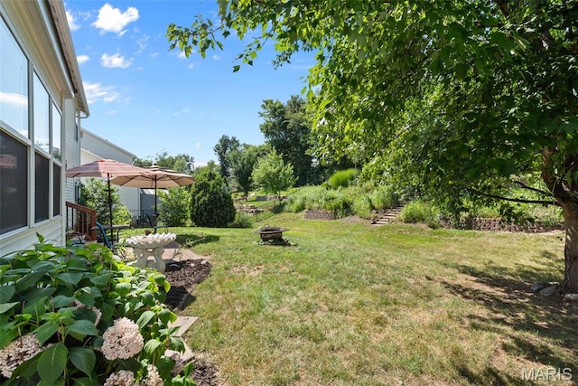 269 Sassafras Parc Dr, Ofallon, MO 63368 - view of green lawn with a fire pit