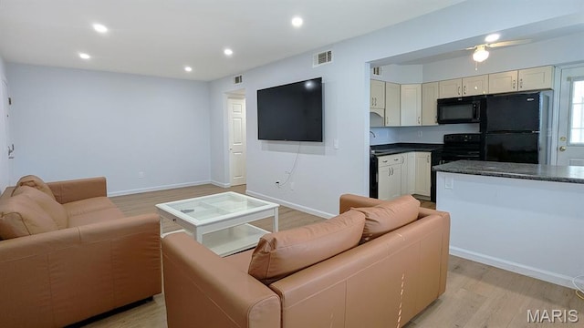 1669 Mayenne Ct Unit B, Mehlville, MO 63125 - living area featuring light wood-type flooring, recessed lighting, and a ceiling fan