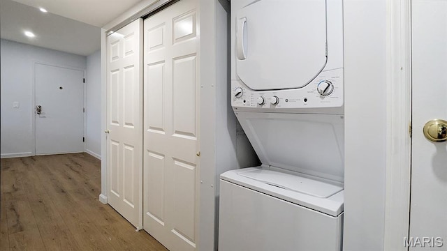1669 Mayenne Ct Unit B, Mehlville, MO 63125 - washroom with stacked washer / dryer, light wood-style floors, and recessed lighting