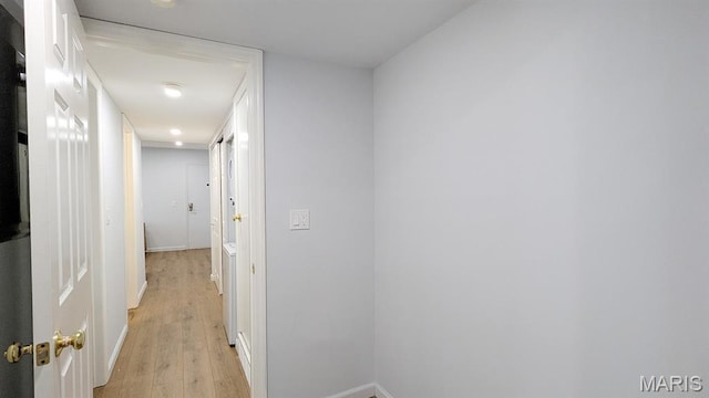 1669 Mayenne Ct Unit B, Mehlville, MO 63125 - hall featuring light wood-style floors and baseboards