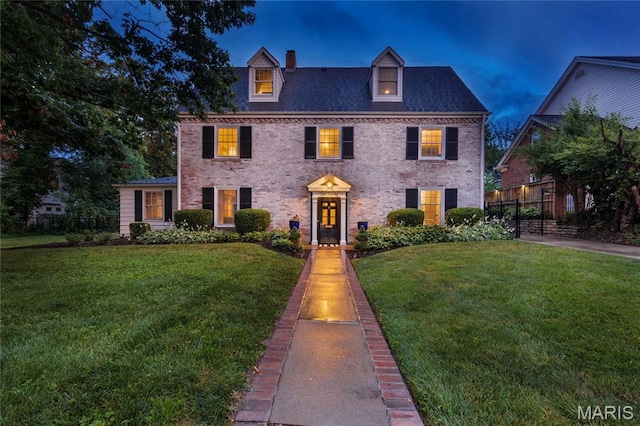 220 Orrick Ln, Kirkwood, MO 63122 - colonial inspired home with a chimney and brick siding