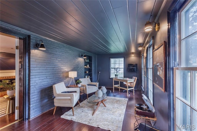 220 Orrick Ln, Kirkwood, MO 63122 - sitting room featuring hardwood / wood-style floors, built in shelves, and brick wall
