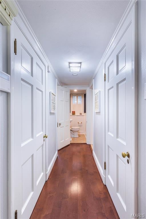 220 Orrick Ln, Kirkwood, MO 63122 - hallway featuring dark wood-type flooring and crown molding