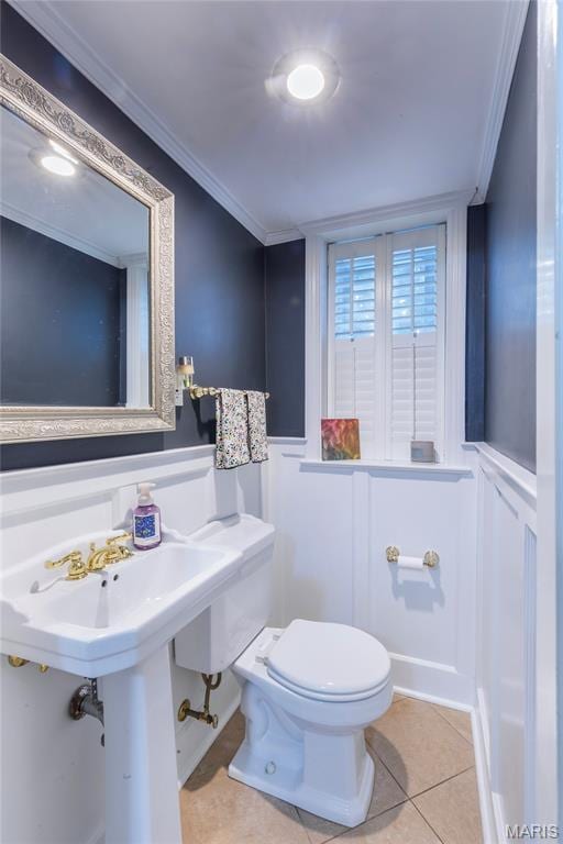 220 Orrick Ln, Kirkwood, MO 63122 - bathroom with tile patterned floors, crown molding, a wainscoted wall, and a decorative wall
