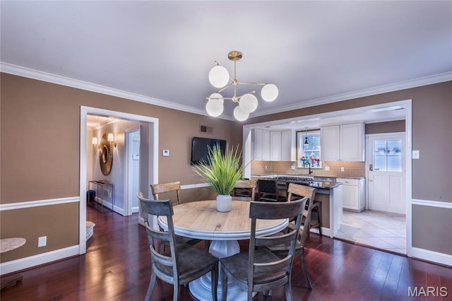220 Orrick Ln, Kirkwood, MO 63122 - dining room featuring hardwood / wood-style flooring and ornamental molding