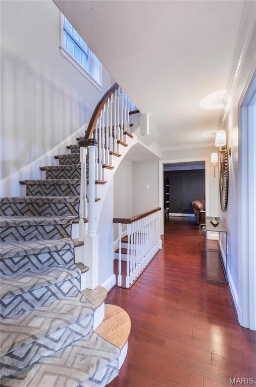 220 Orrick Ln, Kirkwood, MO 63122 - staircase with wood finished floors and ornamental molding