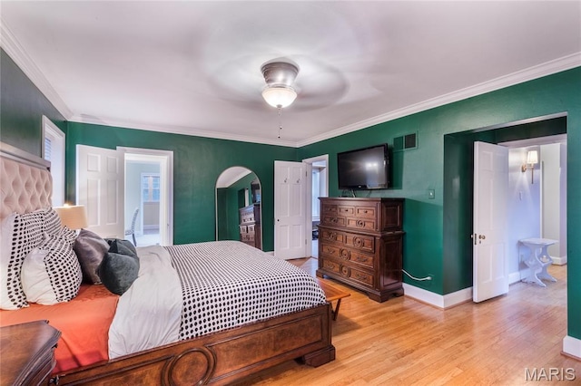 220 Orrick Ln, Kirkwood, MO 63122 - bedroom featuring arched walkways, light wood-type flooring, ornamental molding, and ceiling fan