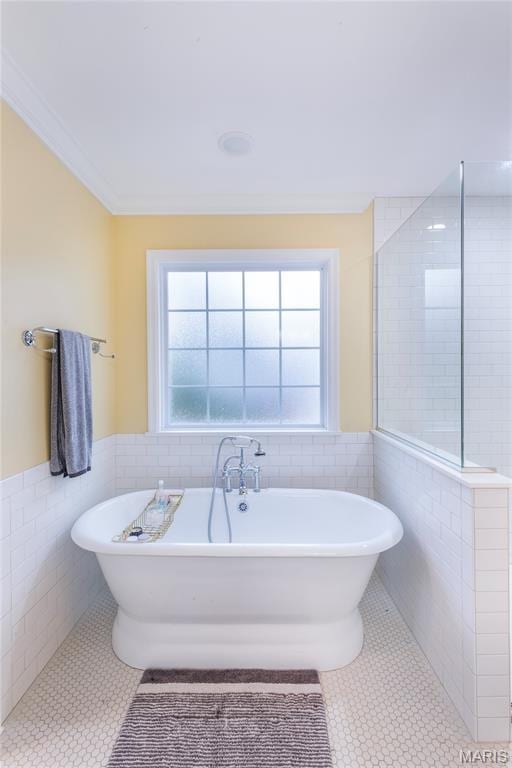 220 Orrick Ln, Kirkwood, MO 63122 - bathroom with tile walls, tile patterned floors, a wainscoted wall, and a soaking tub