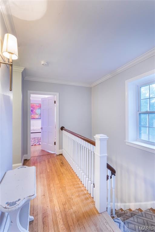 220 Orrick Ln, Kirkwood, MO 63122 - corridor with light wood finished floors, ornamental molding, and an upstairs landing