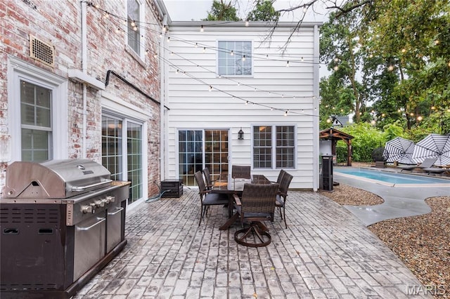 220 Orrick Ln, Kirkwood, MO 63122 - view of patio featuring an outdoor pool, outdoor dining area, a grill, and a gazebo