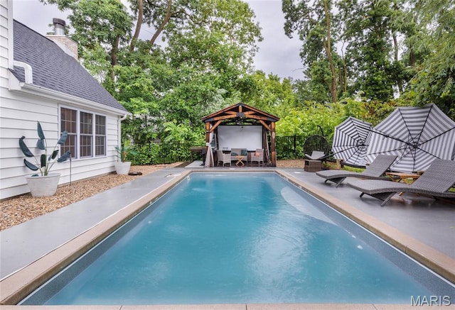 220 Orrick Ln, Kirkwood, MO 63122 - view of swimming pool with a fenced backyard, a patio area, view of wooded area, and a gazebo