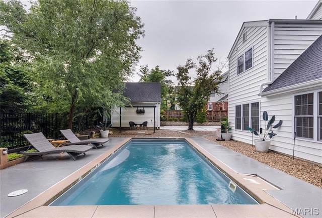 220 Orrick Ln, Kirkwood, MO 63122 - view of swimming pool with an outbuilding, a fenced backyard, and a patio area