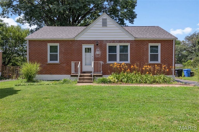 1485 E Duchesne Dr, Florissant, MO 63031 - bungalow-style house with a front yard, a shingled roof, and brick siding