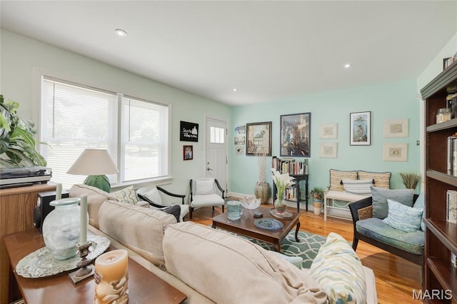 1485 E Duchesne Dr, Florissant, MO 63031 - living room featuring light wood-type flooring and recessed lighting