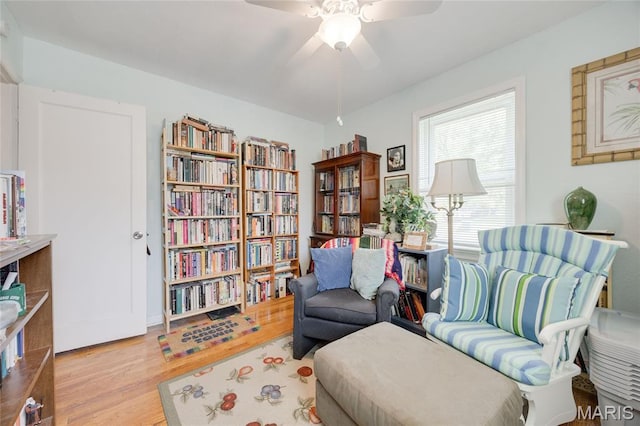 1485 E Duchesne Dr, Florissant, MO 63031 - living area featuring wood finished floors and a ceiling fan
