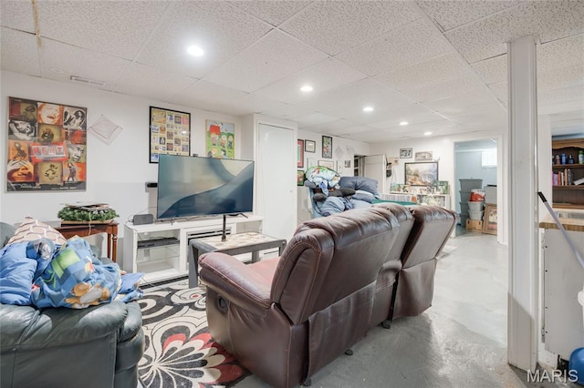 1485 E Duchesne Dr, Florissant, MO 63031 - living room featuring concrete floors, a paneled ceiling, and recessed lighting