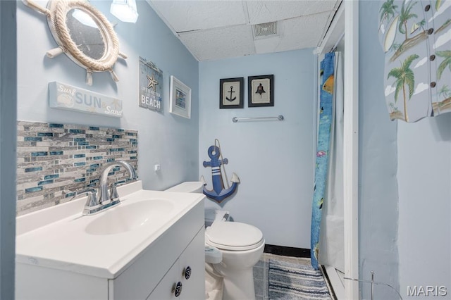 1485 E Duchesne Dr, Florissant, MO 63031 - bathroom featuring a drop ceiling, backsplash, vanity, and a shower with shower curtain