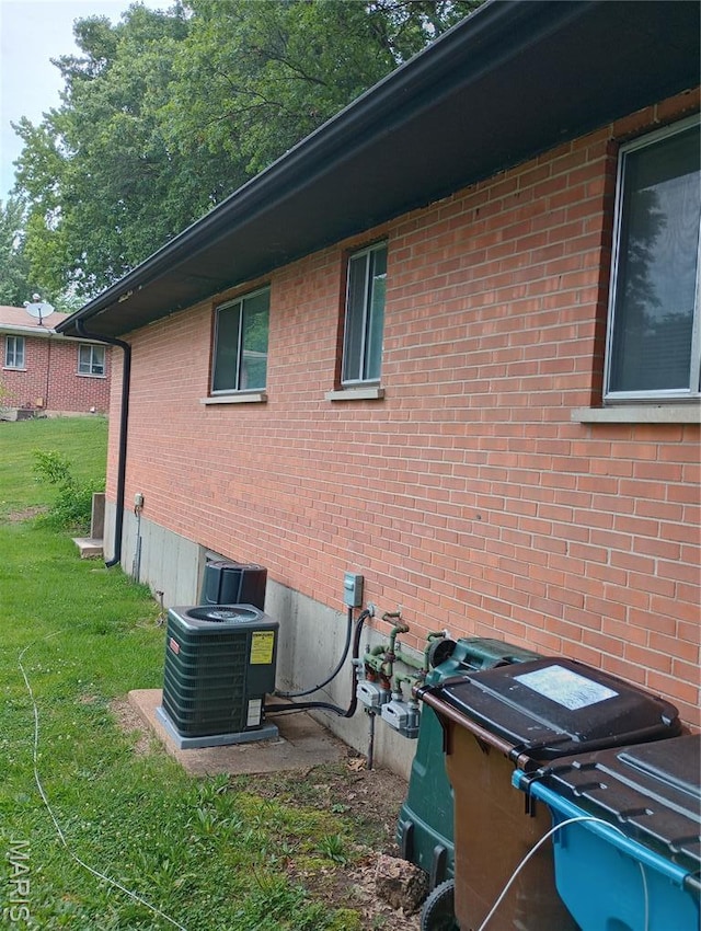 501 Carson Rd, Ferguson, MO 63135 - view of home's exterior featuring a lawn and brick siding