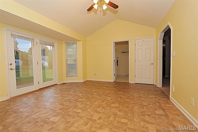 643 Woodgate St, Farmington, MO 63640 - unfurnished room featuring vaulted ceiling, ceiling fan, a textured ceiling, and brick patterned flooring