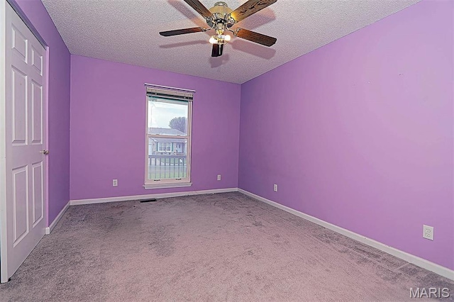643 Woodgate St, Farmington, MO 63640 - carpeted spare room featuring a textured ceiling and a ceiling fan