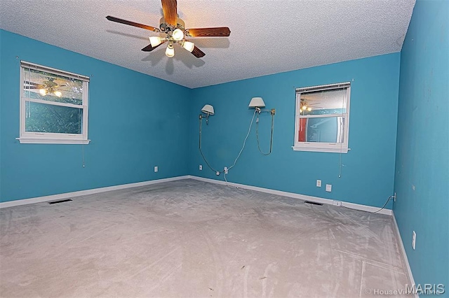 643 Woodgate St, Farmington, MO 63640 - carpeted spare room with a textured ceiling and a ceiling fan