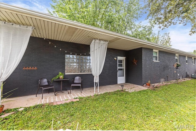 328 S Windmill St, Marine, IL 62061 - back of house featuring brick siding, a lawn, and a patio area