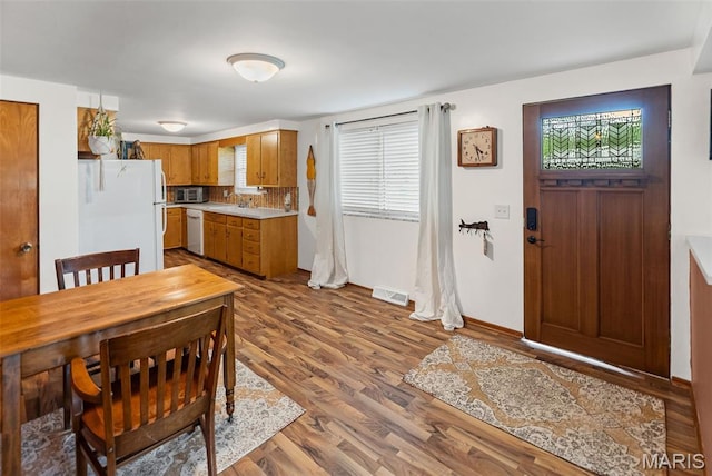 328 S Windmill St, Marine, IL 62061 - kitchen featuring white appliances, healthy amount of natural light, light countertops, and wood finished floors