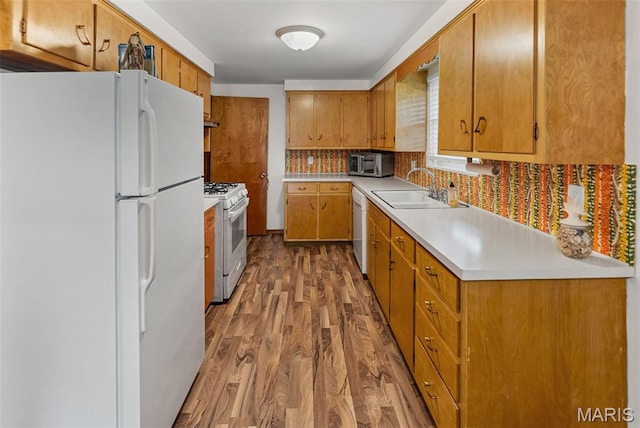 328 S Windmill St, Marine, IL 62061 - kitchen featuring white appliances, wood finished floors, light countertops, tasteful backsplash, and brown cabinetry