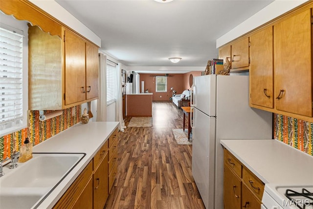 328 S Windmill St, Marine, IL 62061 - kitchen with dark wood-type flooring, brown cabinets, light countertops, and white appliances