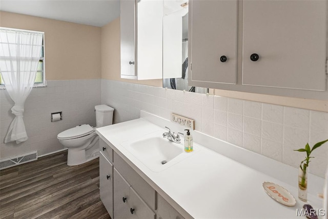 328 S Windmill St, Marine, IL 62061 - bathroom with vanity, tile walls, wood finished floors, and wainscoting