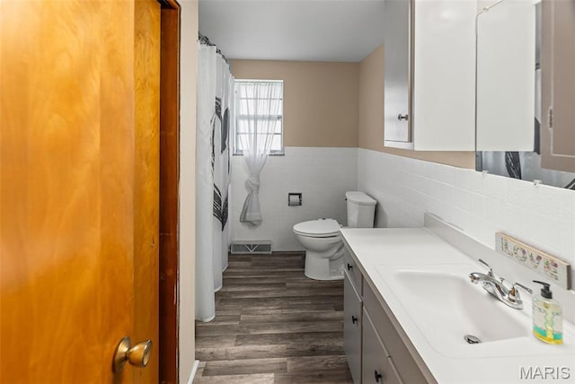 328 S Windmill St, Marine, IL 62061 - bathroom with tile walls, vanity, wood finished floors, a wainscoted wall, and a shower with shower curtain