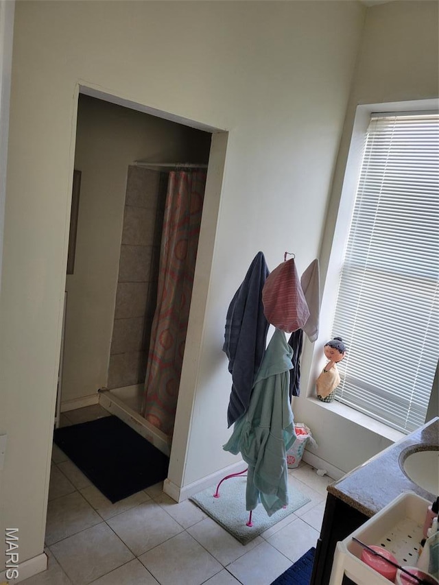 3761 Finney Ave, Saint Louis, MO 63113 - bathroom with tile patterned floors, vanity, and a tile shower