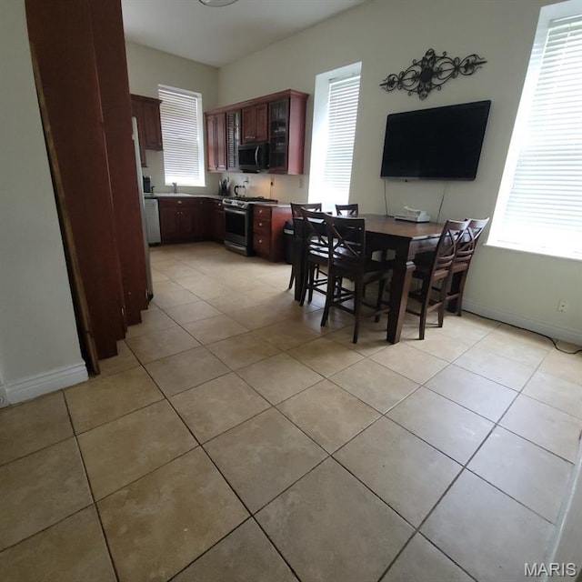 3761 Finney Ave, Saint Louis, MO 63113 - dining space featuring light tile patterned flooring and plenty of natural light