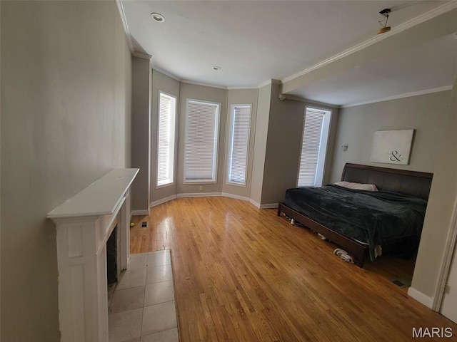 3761 Finney Ave, Saint Louis, MO 63113 - bedroom with ornamental molding and light wood-style floors