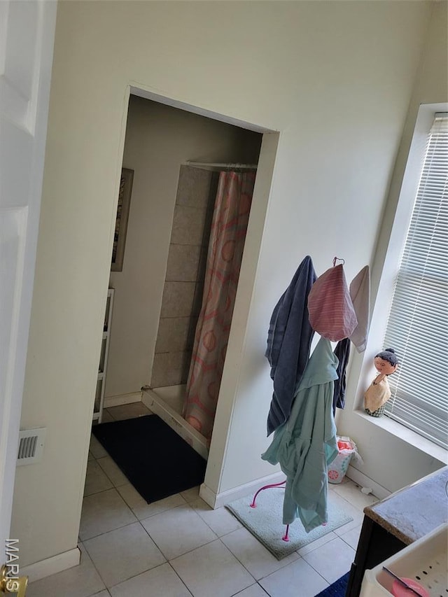 3761 Finney Ave, Saint Louis, MO 63113 - hall with tile patterned floors and baseboards