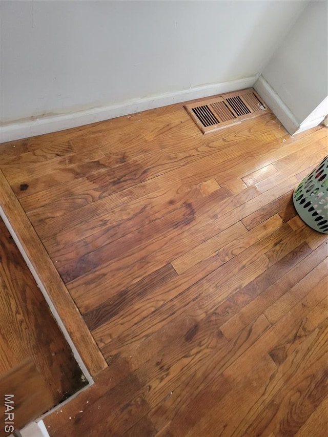 3761 Finney Ave, Saint Louis, MO 63113 - detailed view of wood finished floors and baseboards