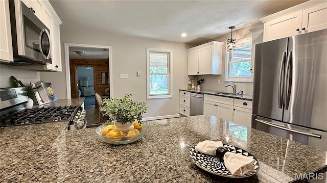 504 N Moore St, Waterloo, IL 62298 - kitchen with stainless steel appliances, white cabinets, dark stone counters, decorative light fixtures, and recessed lighting