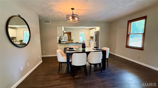 504 N Moore St, Waterloo, IL 62298 - dining room featuring dark wood-type flooring and a chandelier